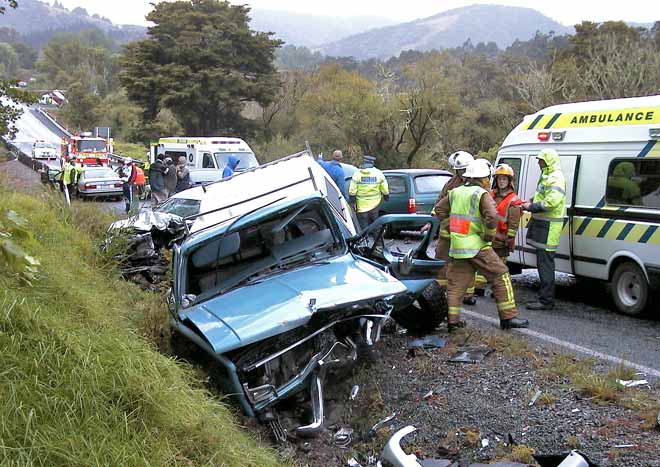 Emergency service personnel attend a serious car crash south of the 