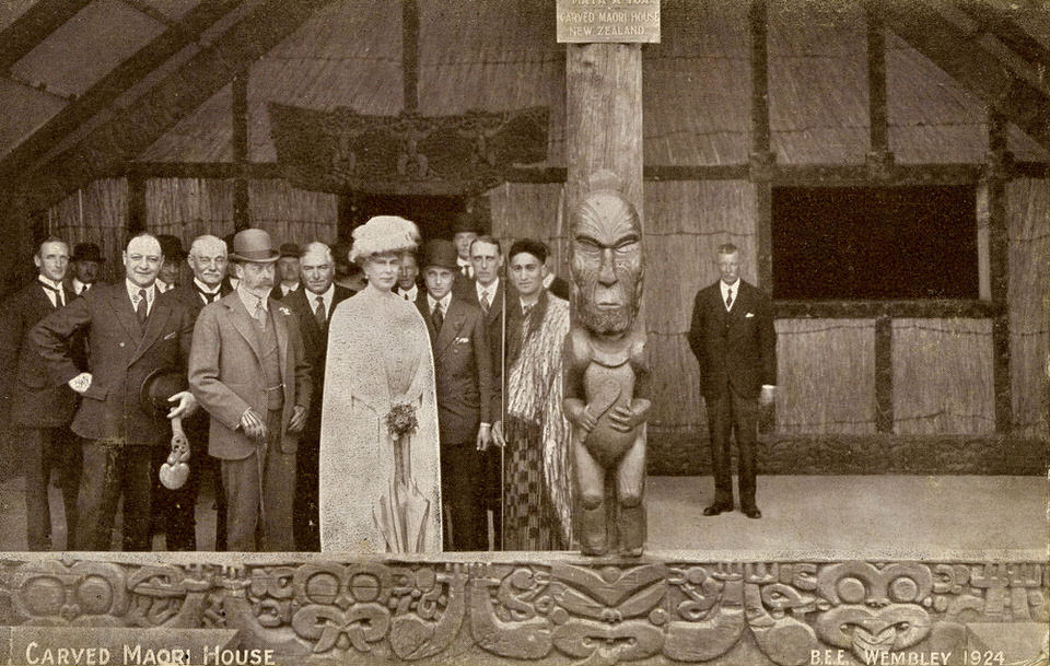 On their second visit to Mataatua at the British Empire Exhibition, 1924–25, King George V, Queen Mary, and Prince Edward pose with Hohepa Te Kiri Te Riaki of Te Arawa – a long-standing enemy of Ngāti Awa. ©Trustees of the British Museum